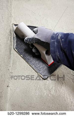 Roughcast, plastering trowel, new homes under construction, construction site View Large Photo Image Stock Photograph - Roughcast, plastering trowel, new homes under construction, construction site. Fotosearch