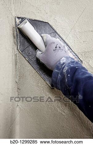 Roughcast, plastering trowel, new homes under construction, construction site View Large Photo Image Stock Photography - Roughcast, plastering trowel, new homes under construction, construction site. Fotosearch