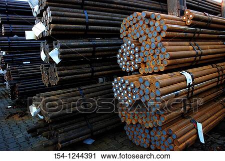 Stock Image - Round steel stock of a metal plant. Fotosearch