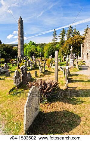 Round tower and gravestones at the historic site of Glendalough, County Wicklow, Ireland, Europe View Large Photo Image Stock Image - Round tower and gravestones at the historic site of Glendalough, County Wicklow, Ireland, Europe. Fotosearch