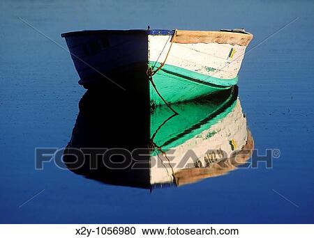 Rowboat on tranquil water, Cape Cod, MA View Large Photo Image Stock Image - Rowboat on tranquil water, Cape Cod, MA. Fotosearch