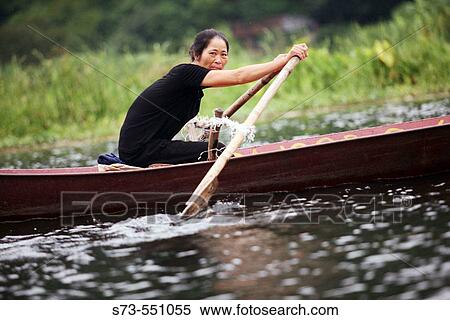 Rower in boat. My Duc. Hanoi. Vietnam. View Large Photo Image Stock Photography - Rower in boat. My Duc. Hanoi. Vietnam.. Fotosearch