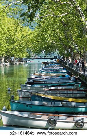 Rowing boats on the tree-lined Canal du Vass?? in Annecy, France View Large Photo Image Stock Photography - Rowing boats on the tree-lined Canal du Vass?? in Annecy, France. Fotosearch