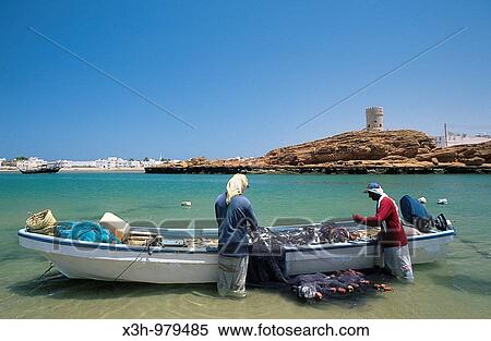 rowing fishing boat on the beach of Sur, Sultanate of Oman, Arabian Peninsula, Asia View Large Photo Image Stock Photography - rowing fishing boat on the beach of Sur, Sultanate of Oman, Arabian Peninsula, Asia. Fotosearch