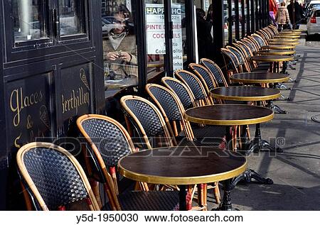 rows of chairs and tables in front of restaurant, old town, Paris, France View Large Photo Image Stock Image - rows of chairs and tables in front of restaurant, old town, Paris, France. Fotosearch