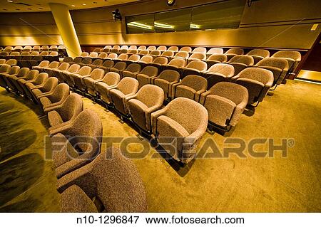 Rows of chairs in an auditorium View Large Photo Image Stock Photo - Rows of chairs in an auditorium. Fotosearch