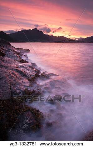 Rugged rocky coastline and mountain view at Stamsund, Vestv? goy, Lofoten islands, Norway View Large Photo Image Stock Image - Rugged rocky coastline and mountain view at Stamsund, Vestv? goy, Lofoten islands, Norway. Fotosearch