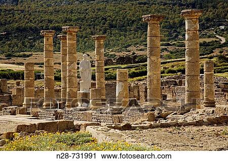 Ruins of basilica, archaeological site of old roman city of Baelo Claudia, Bolonia, Tarifa. Costa de la Luz, Cadiz province, Andalusia, Spain View Large Photo Image Stock Image - Ruins of basilica, archaeological site of old roman city of Baelo Claudia, Bolonia, Tarifa. Costa de la Luz, Cadiz province, Andalusia, Spain. Fotosearch