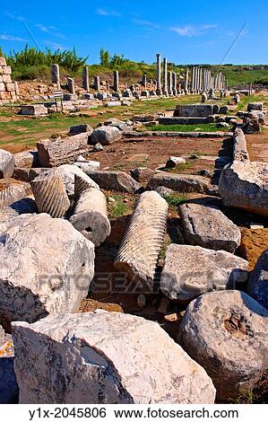 Ruins of the Roman Columned street which was lined with shops & stores. Perge (Perga) archaeological site, Turkey. View Large Photo Image Stock Photograph - Ruins of the Roman Columned street which was lined with shops & stores. Perge (Perga) archaeological site, Turkey.. Fotosearch