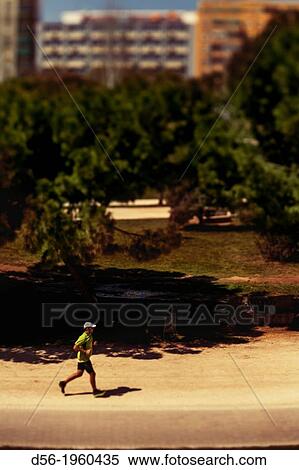 Runner at the old river bed Turia, Valencia, Spain View Large Photo Image Stock Photography - Runner at the old river bed Turia, Valencia, Spain. Fotosearch