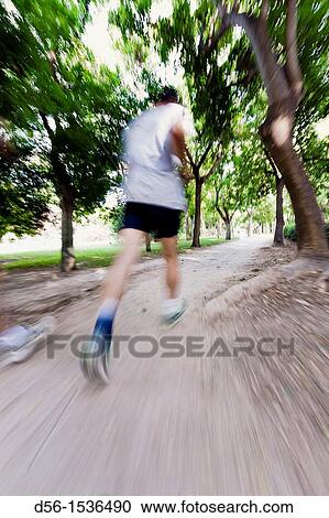 Runners at the old river bed Turia, Valencia, Spain View Large Photo Image Stock Image - Runners at the old river bed Turia, Valencia, Spain. Fotosearch