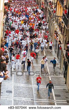 Runners jockey for their position in the Calle Estafeta minutes before the running of the bulls Pamplona Navarre Spain View Large Photo Image Picture - Runners jockey for their position in the Calle Estafeta minutes before the running of the bulls Pamplona Navarre Spain. Fotosearch
