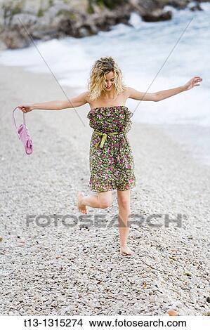 Running on the beach young lady View Large Photo Image Picture - Running on the beach young lady. Fotosearch