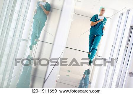 Stock Photo - running surgeon in the operating room hallway, Onkologikoa Hospital, Oncology Institute, Case Center for prevention, diagnosis and treatment of cancer, Donostia, San Sebastian, Gipuzkoa, Basque Country, Spain. Fotosearch