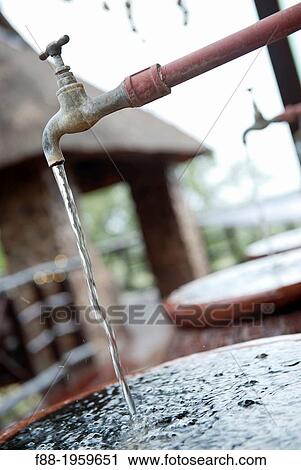 Stock Image - Running tap, Bush Lodge, Mpumalanga, South Africa. Fotosearch