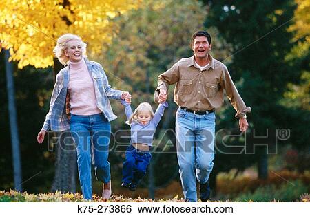 running with their daughter View Large Photo Image Stock Photograph - running with their daughter. Fotosearch