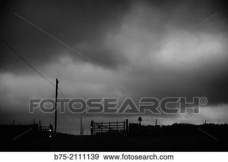 Rural landscape with electric poles and barriers with stormy sky at sunset in Yorkshire Dales, England, UK, Europe View Large Photo Image Stock Photo - Rural landscape with electric poles and barriers with stormy sky at sunset in Yorkshire Dales, England, UK, Europe. Fotosearch