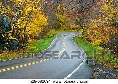 Rural road winding through Smugglers Notch Vermont USA View Large Photo Image Picture - Rural road winding through Smugglers Notch Vermont USA. Fotosearch