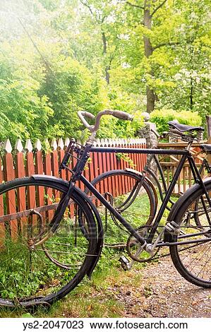 Rural scene with old retro bikes in a bicycle rack, Sweden. View Large Photo Image Stock Image - Rural scene with old retro bikes in a bicycle rack, Sweden.. Fotosearch