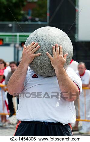 Stock Photograph - Rural Sports,? Plaza de los Fueros? Tribunals Square, San Ferm? n street-partying, Pamplona, Navarra Navarre, Spain, Europe. Fotosearch
