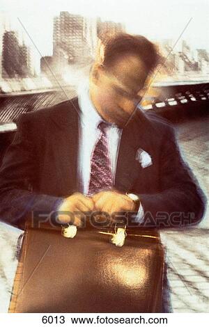 Rushed businessman View Large Photo Image Stock Image - Rushed businessman. Fotosearch