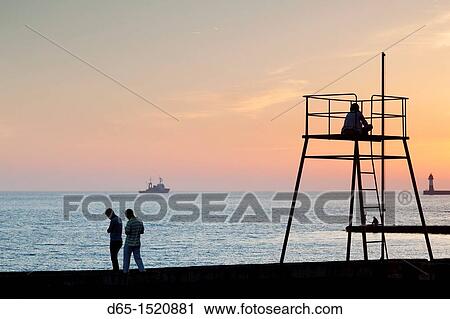 Russia, Black Sea Coast, Sochi, Lighthouse Beach, silhouettes, sunset, NR View Large Photo Image Stock Image - Russia, Black Sea Coast, Sochi, Lighthouse Beach, silhouettes, sunset, NR. Fotosearch