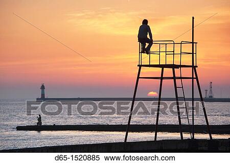 Russia, Black Sea Coast, Sochi, Lighthouse Beach, silhouettes, sunset, NR View Large Photo Image Stock Photography - Russia, Black Sea Coast, Sochi, Lighthouse Beach, silhouettes, sunset, NR. Fotosearch