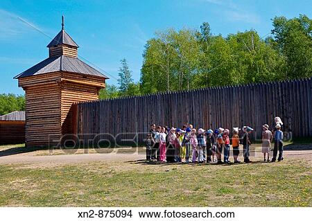 Russia. Irkutsk. The Taltzy Museum of Wooden Architecture. The Ilimsk Fortress with school children on tour. View Large Photo Image Picture - Russia. Irkutsk. The Taltzy Museum of Wooden Architecture. The Ilimsk Fortress with school children on tour.. Fotosearch