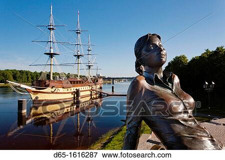 Stock Photo - Russia, Novgorod Oblast, Veliky Novgorod, Novgorod Kremlin, view from the Volkhov River with Russian Girl statue, morning. Fotosearch