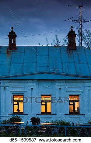 Stock Photo - Russia, Vladimir Oblast, Golden Ring, Suzdal, lit restaurant windows, dusk. Fotosearch