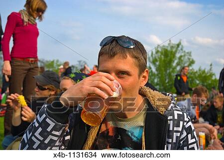 Russian man in his 30s drinking beer out of plastic cup Zizkov district Prague Czech Republic Europe View Large Photo Image Picture - Russian man in his 30s drinking beer out of plastic cup Zizkov district Prague Czech Republic Europe. Fotosearch