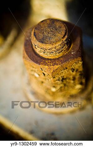 Stock Photo - Rusted bolt of the basement of a light tower. Fotosearch