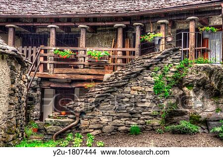 Rustic house in stone with balcony View Large Photo Image Picture - Rustic house in stone with balcony. Fotosearch