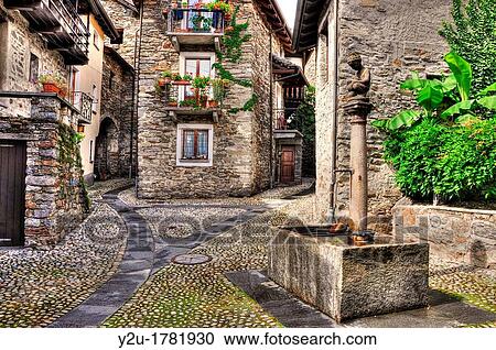 Rustic village with a water well made in stone View Large Photo Image Stock Image - Rustic village with a water well made in stone. Fotosearch