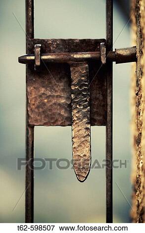 Rusty bolt in a countryside gate. View Large Photo Image Stock Photo - Rusty bolt in a countryside gate.. Fotosearch