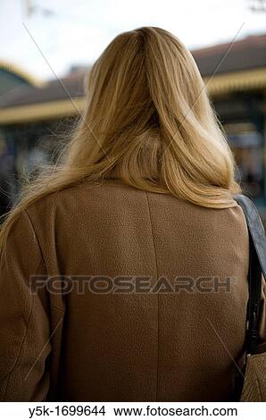 's-Hertogenbosch, Netherlands. A young, blonde woman, waiting for her train to arrive. View Large Photo Image Picture - 's-Hertogenbosch, Netherlands. A young, blonde woman, waiting for her train to arrive.. Fotosearch