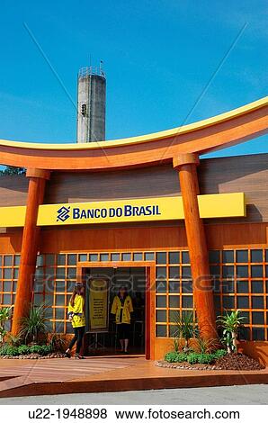 Stock Photo - S? o Paulo, Brazil, hostesses by a fake Torii, an ad for a local branch of Banco do Brasil, at the Festival do Jap? o. Fotosearch
