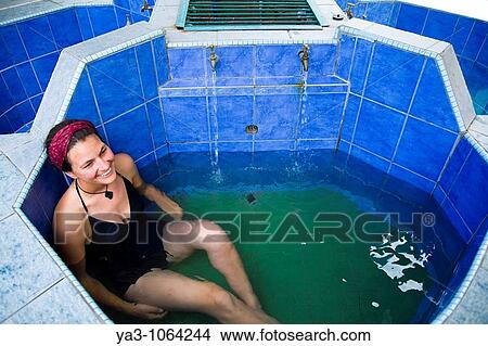 Sabah Malaysia, Borneo, Kinabalu National Park Woman in her late twenties relaxing in a japanese style hot tub at Poring Hot Springs View Large Photo Image Picture - Sabah Malaysia, Borneo, Kinabalu National Park Woman in her late twenties relaxing in a japanese style hot tub at Poring Hot Springs. Fotosearch