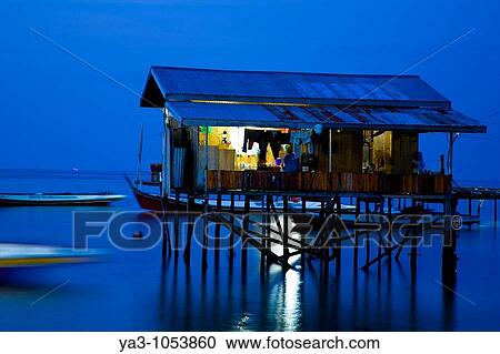 Sabah Malaysia, Borneo, Mabul Island Water village on Mabul Island near Sipadan, viewed at dusk View Large Photo Image Stock Image - Sabah Malaysia, Borneo, Mabul Island Water village on Mabul Island near Sipadan, viewed at dusk. Fotosearch