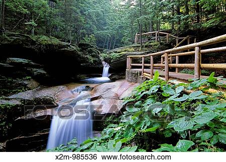 Stock Photograph - Sabbaday Falls, which is near the Kancamagus Highway route 112, which is one of New England's scenic byways located in the White Mountain National Forest of New Hampshire, USA. Fotosearch