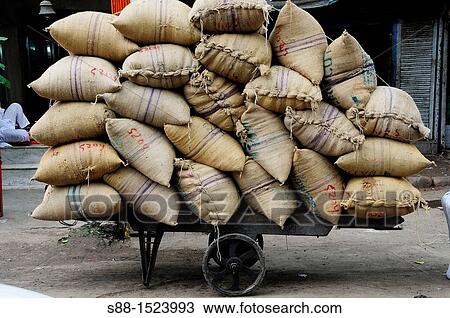 Stock Image - Sack of grain at Chandni Chowk, Old Delhi. Fotosearch