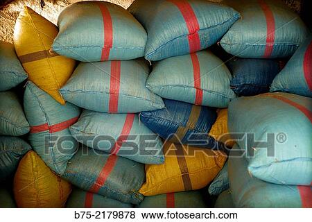Sacks, blue and yellow colors stacked in a grocery warehouse in the Medina of Fez, Morocco, Africa. View Large Photo Image Stock Photo - Sacks, blue and yellow colors stacked in a grocery warehouse in the Medina of Fez, Morocco, Africa.. Fotosearch