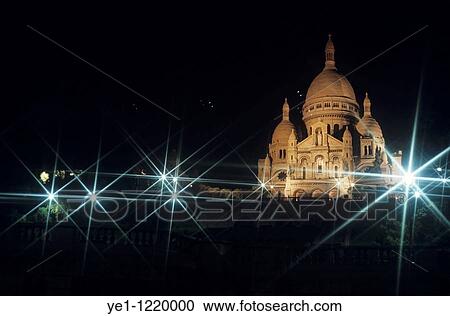Stock Image - Sacre Coeur lit up at night with flood lights, Paris, France.. Fotosearch