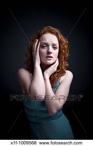 Stock Photo - sad red haired woman girl crying. Fotosearch