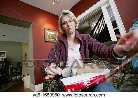 sad woman wrapping presents View Large Photo Image Stock Image - sad woman wrapping presents. Fotosearch