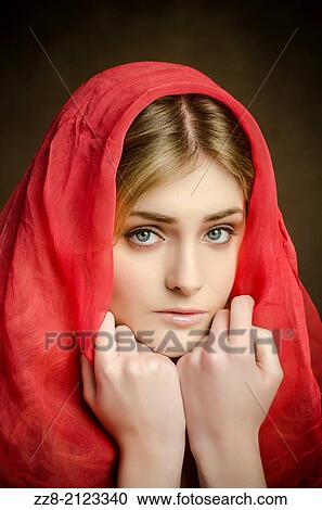 Sad young woman covered with a red scarf. View Large Photo Image Stock Image - Sad young woman covered with a red scarf.. Fotosearch