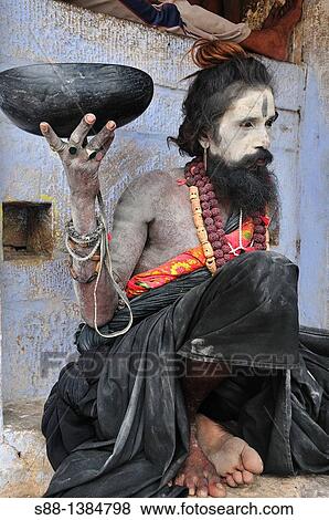 Sadhu at the ghat by the Ganges River View Large Photo Image Stock Photo - Sadhu at the ghat by the Ganges River. Fotosearch