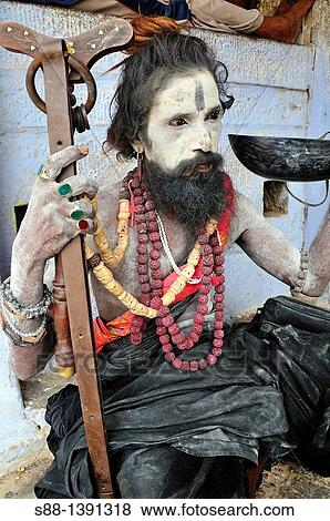 Sadhu at the ghat by the Ganges River View Large Photo Image Stock Photo - Sadhu at the ghat by the Ganges River. Fotosearch