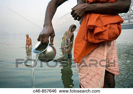Sadhu by the Howrah Bridge. Hooghly River. Kolkata. Ganges River. India. View Large Photo Image Stock Photograph - Sadhu by the Howrah Bridge. Hooghly River. Kolkata. Ganges River. India.. Fotosearch
