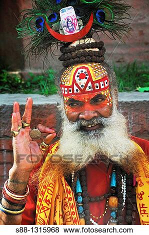 Sadhu professionally posing to the camera all day long at Durbar Square View Large Photo Image Stock Photo - Sadhu professionally posing to the camera all day long at Durbar Square. Fotosearch